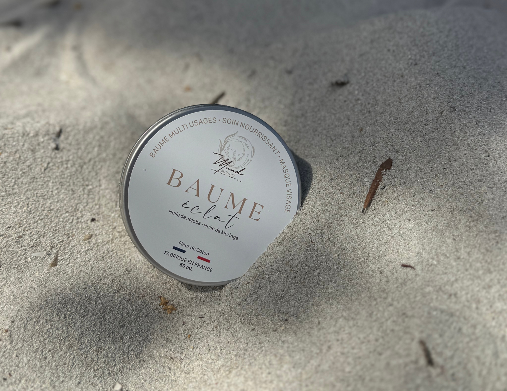 image du baume multi usage dans le sable 